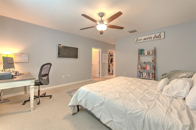 bedroom with ceiling fan and light carpet