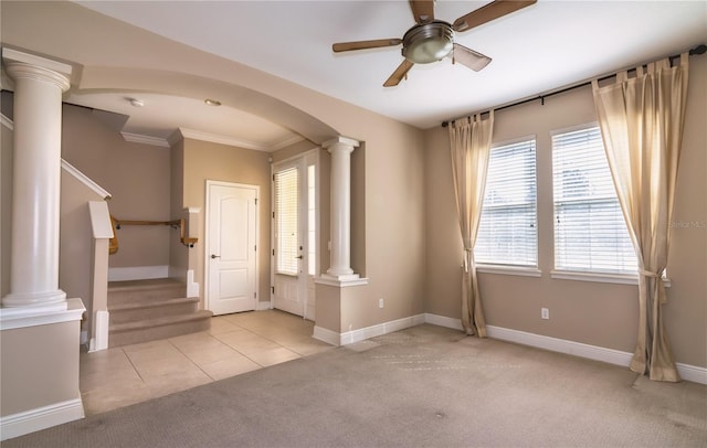 interior space with ornamental molding, ornate columns, and ceiling fan