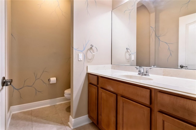 bathroom featuring tile patterned floors, vanity, and toilet