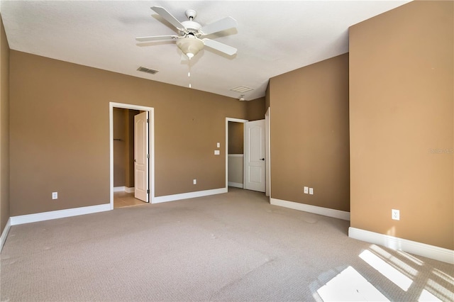 unfurnished bedroom featuring ceiling fan and light colored carpet