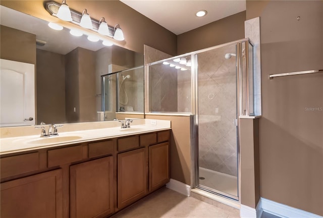 bathroom with vanity, tile patterned floors, and walk in shower