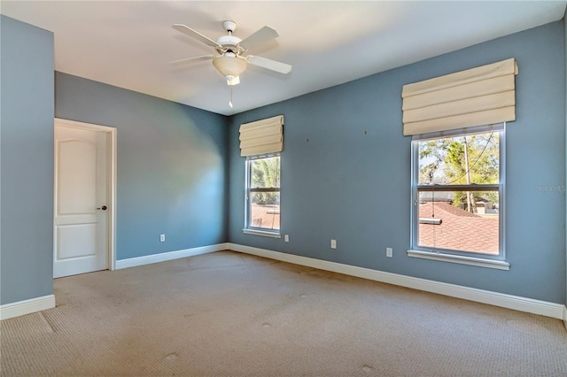 carpeted empty room with ceiling fan