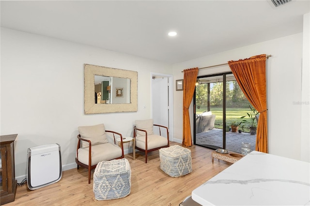 bedroom featuring access to outside and light hardwood / wood-style flooring