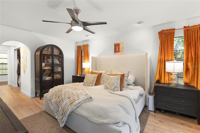 bedroom with light wood-type flooring and ceiling fan