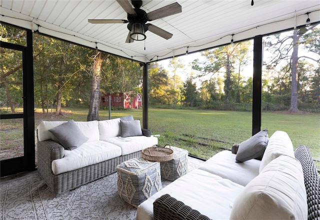 sunroom featuring ceiling fan