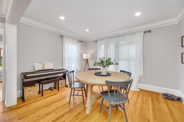 dining area with baseboards, ornamental molding, recessed lighting, and light wood-style floors