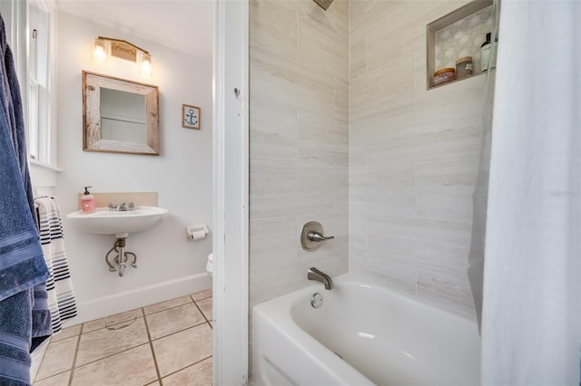 bathroom with toilet, shower / tub combo, tile patterned flooring, and baseboards