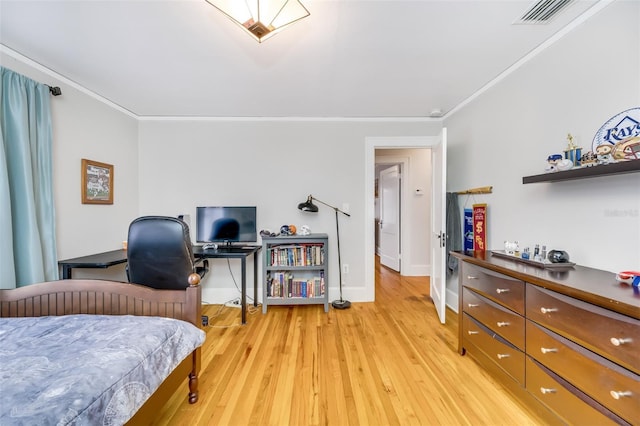 bedroom with ornamental molding, light wood-type flooring, visible vents, and baseboards