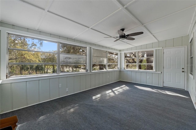 unfurnished sunroom with lofted ceiling and a ceiling fan