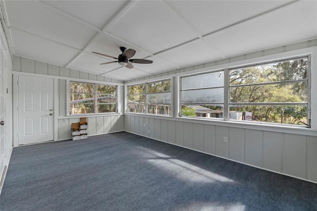 unfurnished sunroom with lofted ceiling, a drop ceiling, and ceiling fan