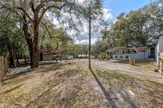 view of yard with a detached carport