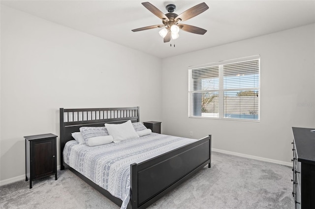 bedroom with light carpet and ceiling fan