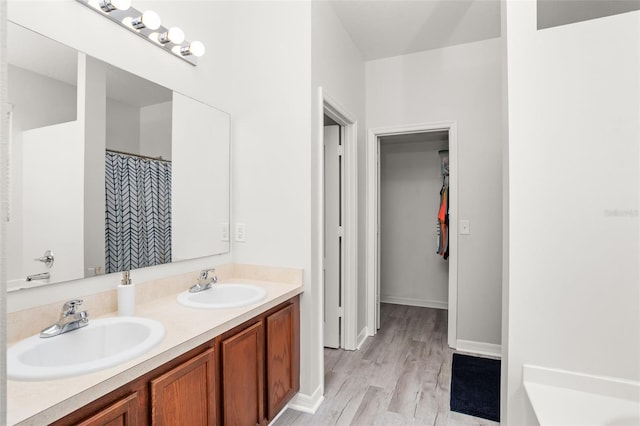 bathroom featuring vanity and hardwood / wood-style floors