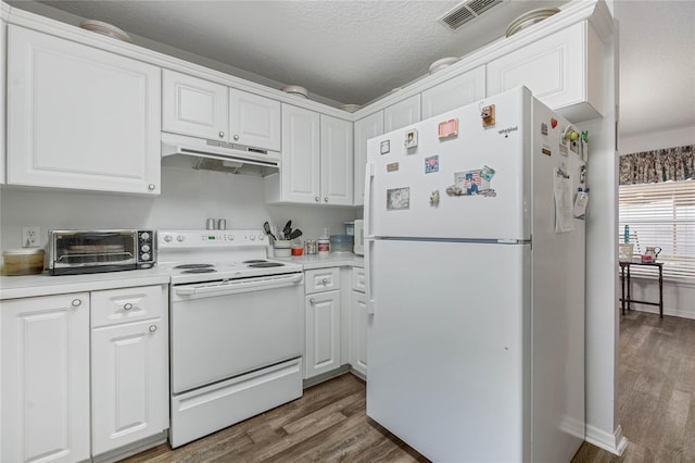 kitchen featuring under cabinet range hood, white appliances, visible vents, white cabinets, and light countertops