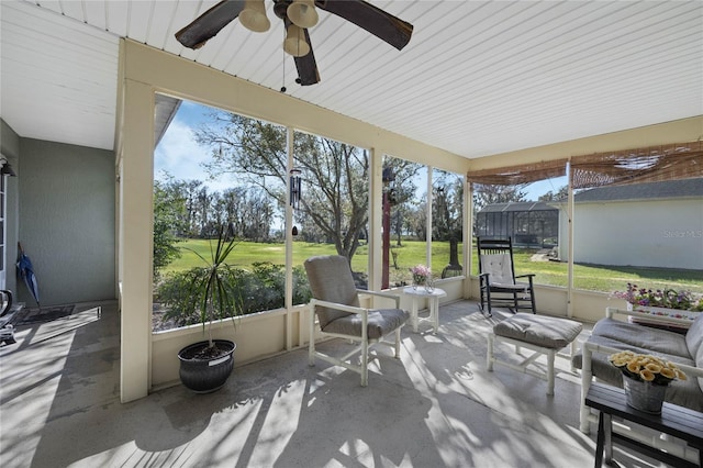 sunroom / solarium with ceiling fan