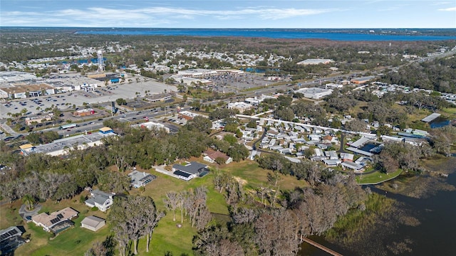 bird's eye view featuring a water view and a residential view