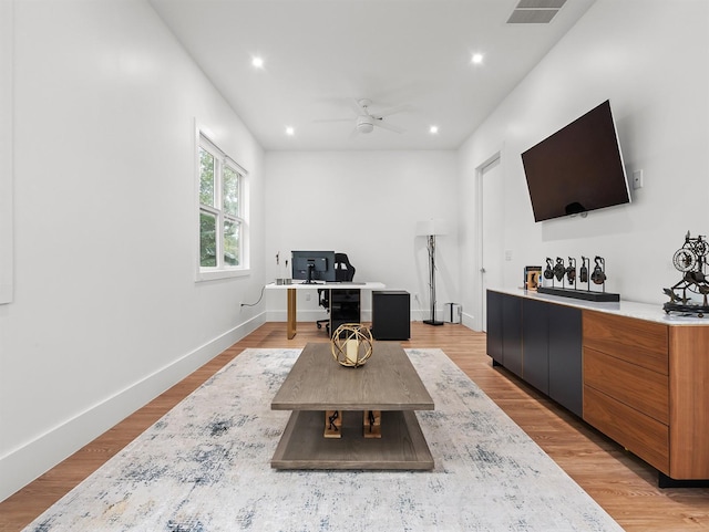 interior space with light wood-style flooring, visible vents, and recessed lighting