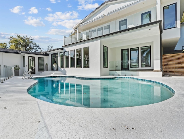 pool with a patio area