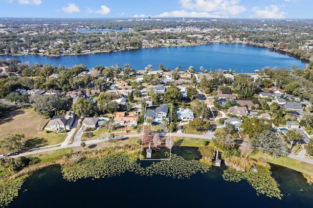 birds eye view of property featuring a residential view and a water view