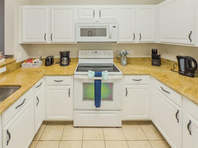 8000 Tuscany Way Unit 4405, Davenport, FL 33896 - kitchen with white appliances, light tile patterned flooring, white cabinets, and light stone countertops
