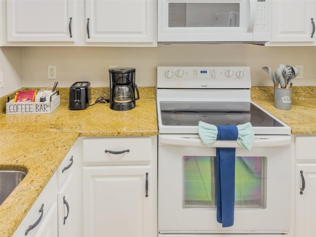 8000 Tuscany Way Unit 4405, Davenport, FL 33896 - kitchen with white appliances, white cabinets, and light stone countertops