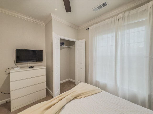 8000 Tuscany Way Unit 4405, Davenport, FL 33896 - carpeted bedroom with crown molding, a ceiling fan, and a closet
