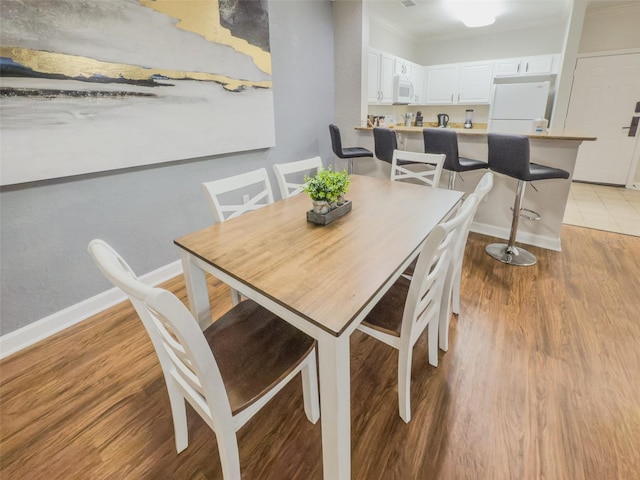 8000 Tuscany Way Unit 4405, Davenport, FL 33896 - dining room with light wood finished floors and ornamental molding