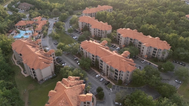 8000 Tuscany Way Unit 4405, Davenport, FL 33896 - drone / aerial view of a pool area and a heavily wooded area