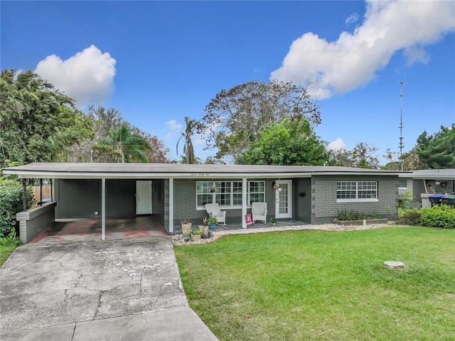 single story home featuring a front lawn and a carport