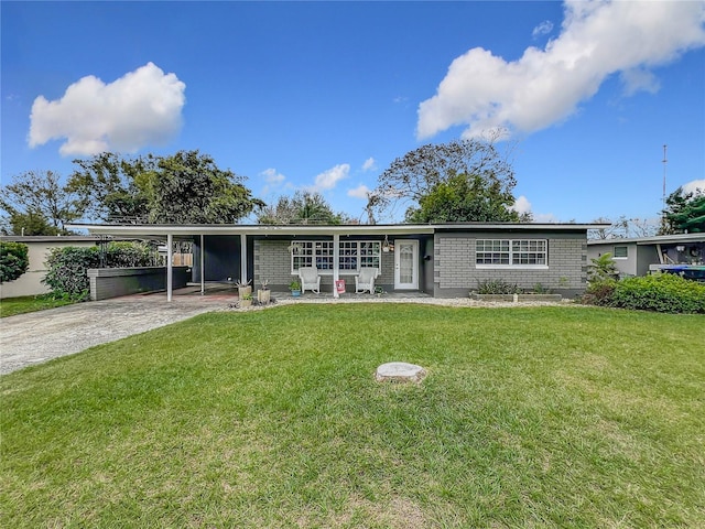 ranch-style home with a front yard and a carport