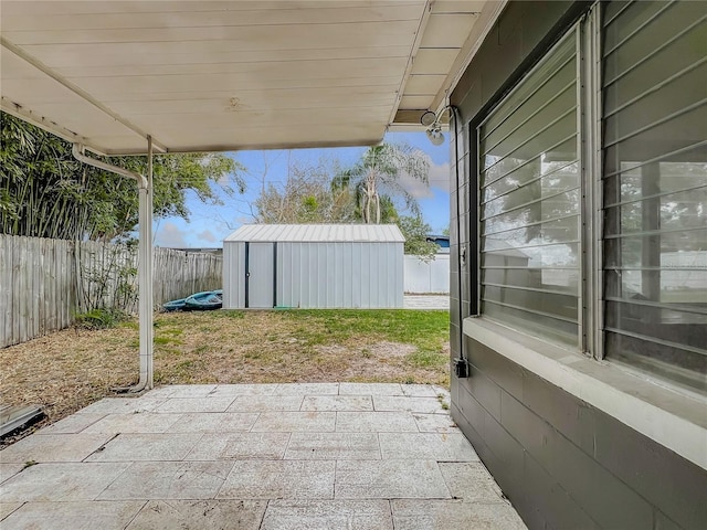 view of patio featuring a shed