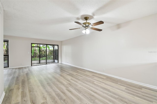 unfurnished room with ceiling fan, light hardwood / wood-style floors, and a textured ceiling