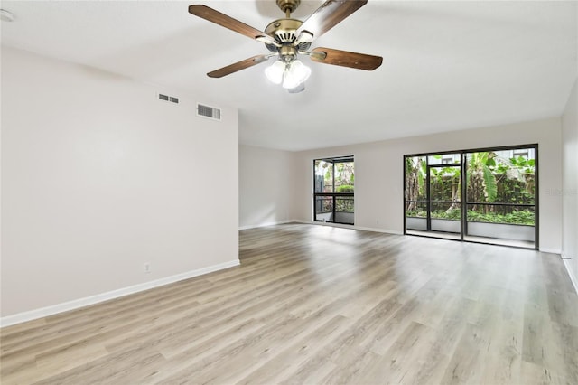 spare room featuring ceiling fan and light hardwood / wood-style flooring