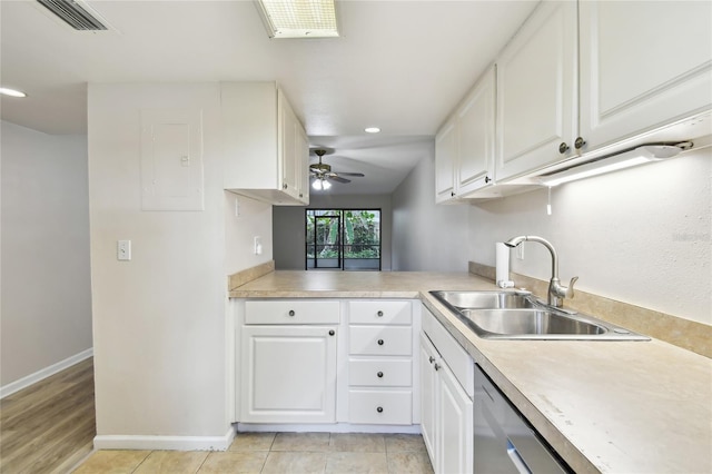 kitchen with white cabinets, stainless steel dishwasher, ceiling fan, light tile patterned floors, and sink