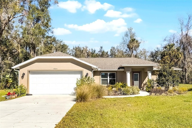 view of front facade featuring a garage, stucco siding, concrete driveway, and a front yard