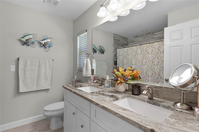 full bathroom with toilet, curtained shower, a sink, and visible vents