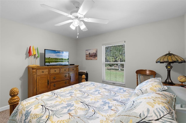 bedroom with baseboards, a ceiling fan, and carpet flooring