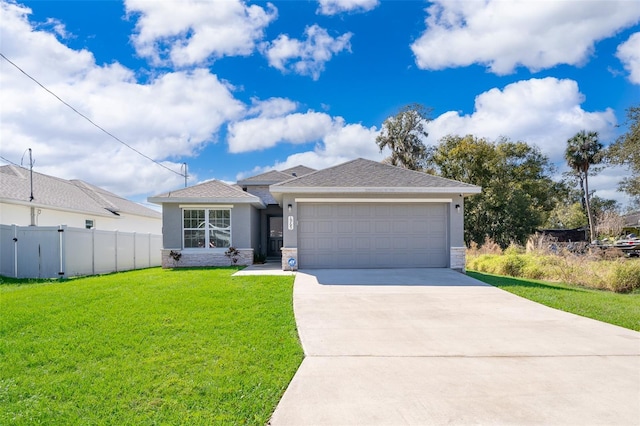 view of front of property with a front lawn and a garage