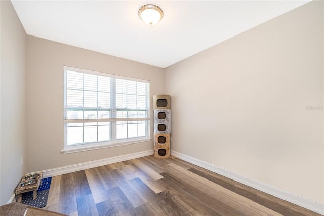 unfurnished room featuring hardwood / wood-style floors