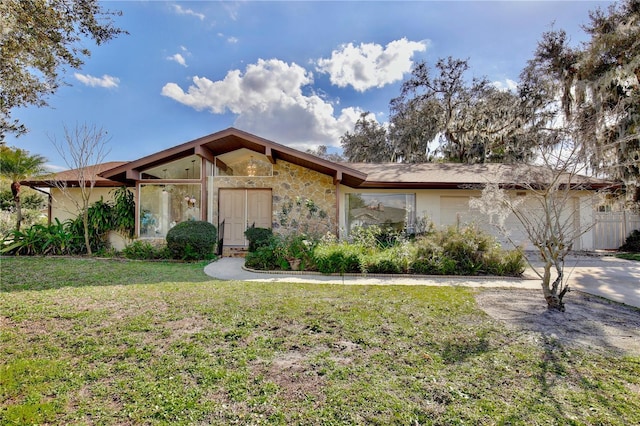 ranch-style house with a front lawn and a garage