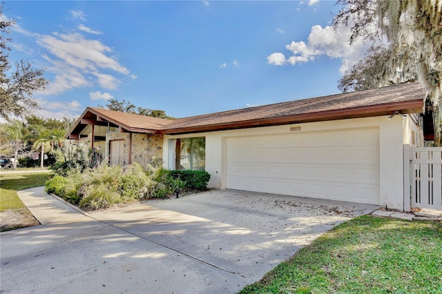 ranch-style home featuring a garage