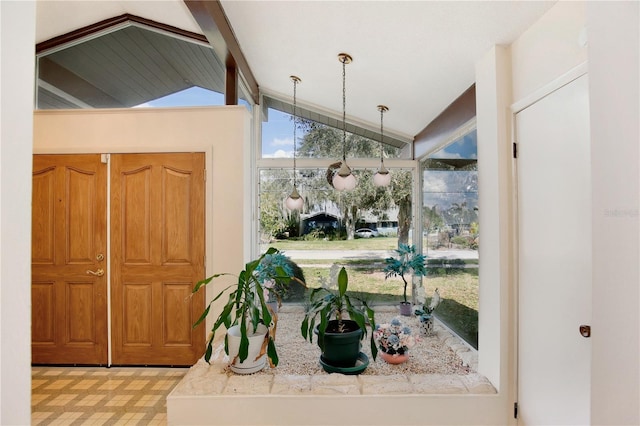 interior space with vaulted ceiling with beams