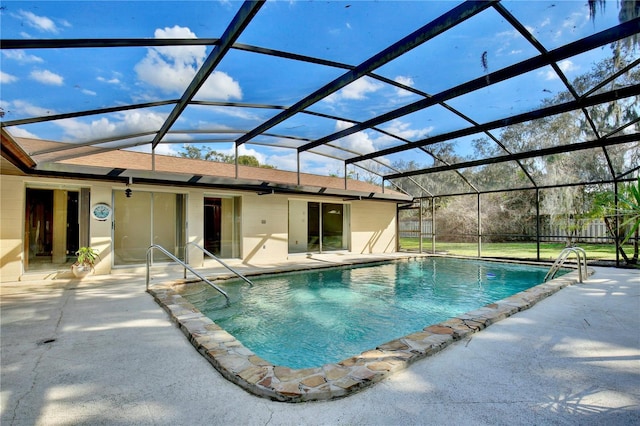 view of swimming pool with a patio area and glass enclosure