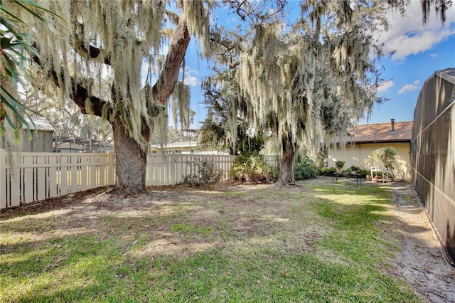 view of yard with a lanai