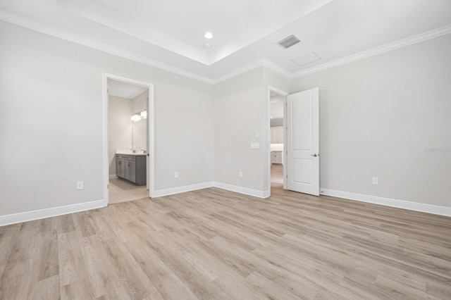 unfurnished bedroom with light wood-style floors, visible vents, and baseboards