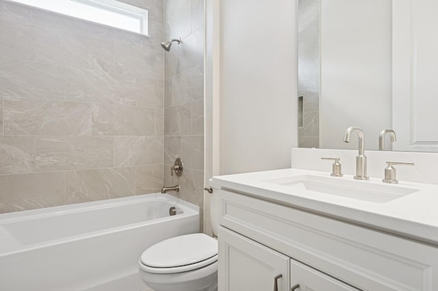 full bath featuring toilet, bathing tub / shower combination, and vanity