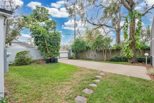 view of yard featuring a gate and fence