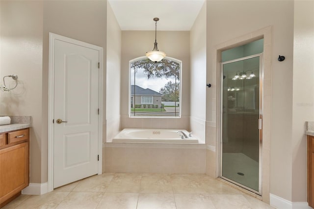 full bath with a garden tub, tile patterned flooring, a shower stall, and vanity