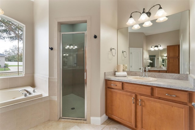 bathroom featuring plenty of natural light, a shower stall, tile patterned flooring, and vanity