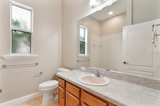 full bath with tile patterned flooring, plenty of natural light, vanity, and toilet